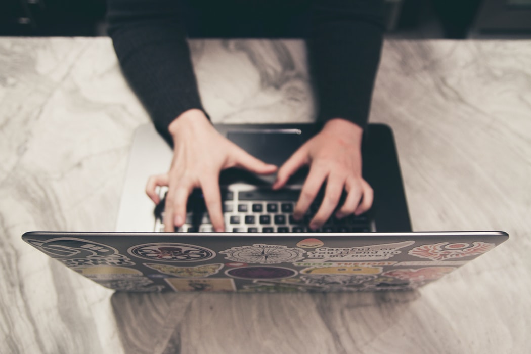 Hands and notebook