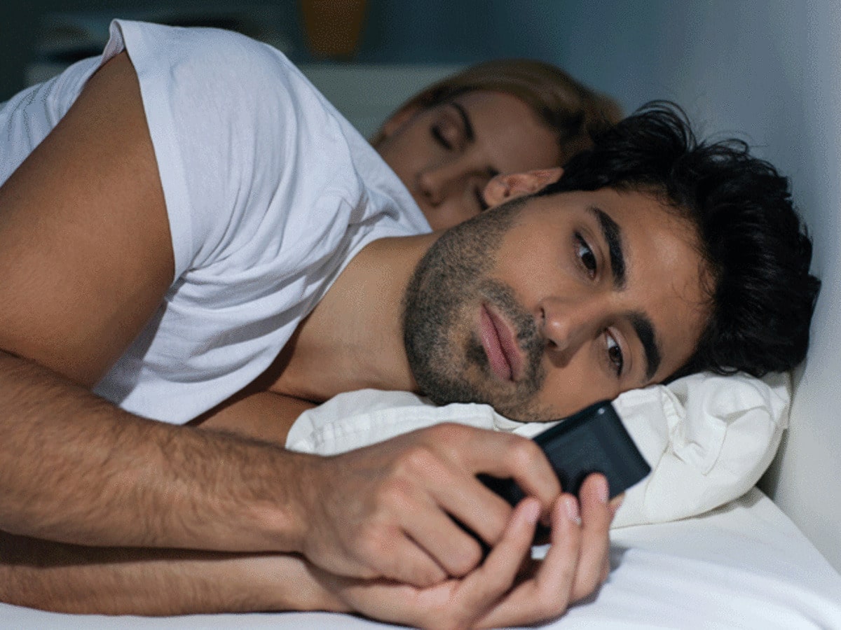 man cheating on a cell phone