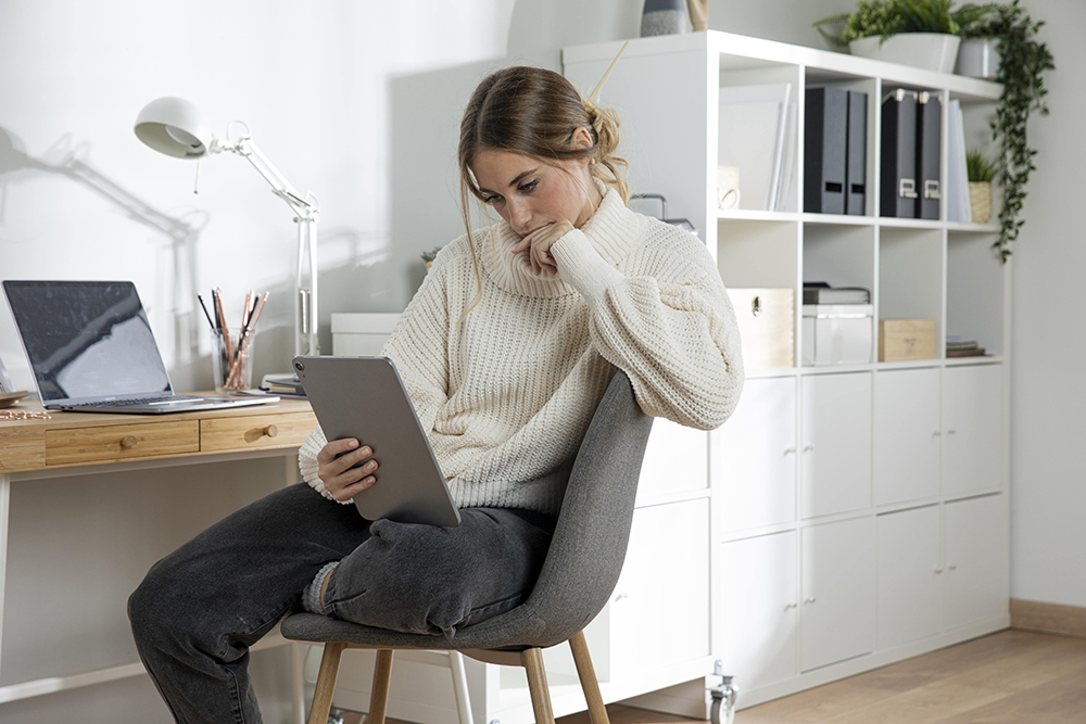 woman holding tablet